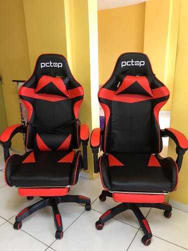 cadeira gamer vermelha e preta super confortavel com apoio de pernas e descanso de pescoço